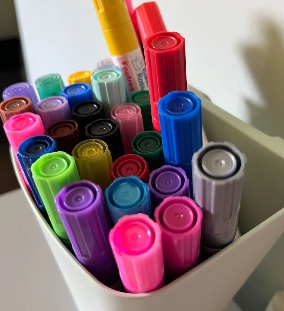 Close up of pens in a wall mounted box