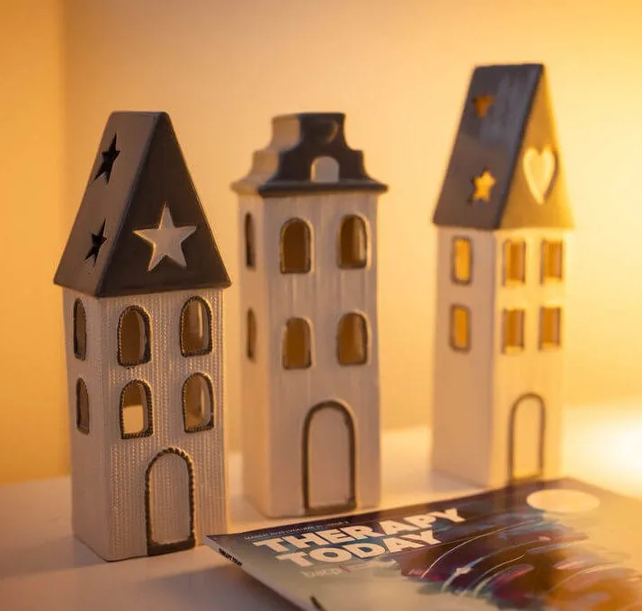Close up photograph of some house ornaments and a "Therapy today" magazine