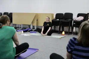 Trainer for the outside in project sat in a meditative position