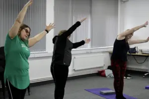Service users of the outside in project doing yoga