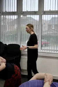 Trainer for the outside in project demonstrating exercises