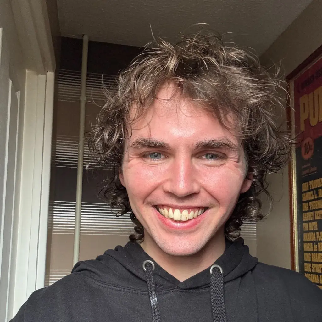 A photo of Cudox's TJ Horrocks smiling into the camera